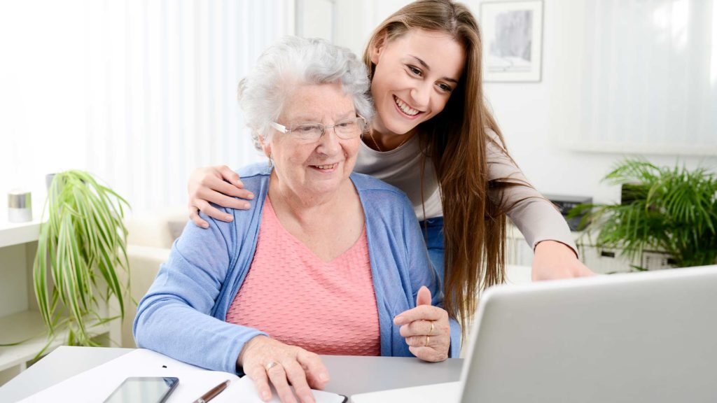Woman and older woman using a laptop